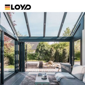 ELOYD modern sunroom interior with a gray sofa, glass walls, and a glass ceiling overlooking a garden with a waterfall.